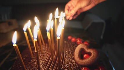 Lighting candles on a birthday cake