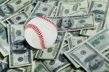 Baseball ball with cash money. Major league strike, lockout and sports betting concept.