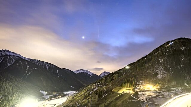 Time Lapse of Sankt Walburg in Ultental during a cloudy sunset and transition into night