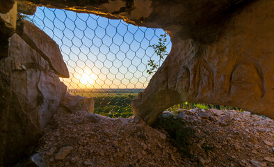 sunset in a cave with a view