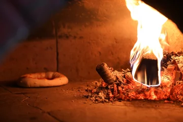Foto op Plexiglas Neapolitan pizza in a wood-fired oven © Olga Tkacheva