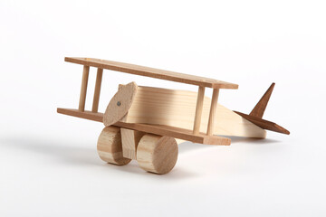 isolated wooden toy airplane