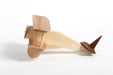 wooden toy airplane on the white background