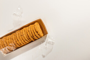 Cookies, Biscuits Pack on White Background.Pack of biscuits, wrapped with transparent plastic.Studio shot,top view.copy space.