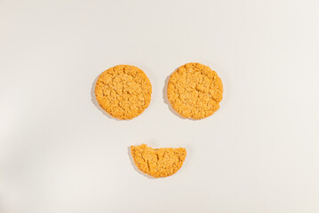 Round cookies over white background, top view.Copy space.