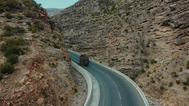 Aerial Following Behind Lorry Driving Along CPEC Road At Fort Munro In Pakistan. Slow Motion