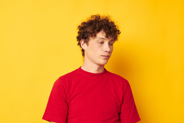 Fototapeta na wymiar guy with red curly hair summer style fashion posing yellow background unaltered