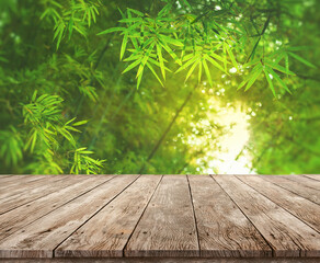 Bamboo forest montage photo with empty old wooden desk for product display advertistment Natural background