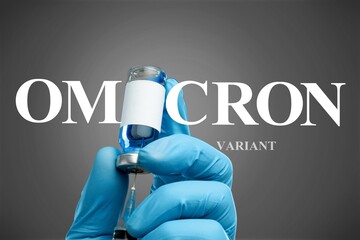 Omicron COVID-19 variant, coronavirus vaccine bottle and syringe in doctor gloved hands.
