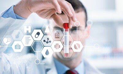 Hand of doctor holding a blood test tube during covid-19 outbreak. Concept variant or strain...