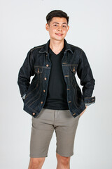 Portrait studio shot Asian young confident handsome cool short hair male hipster model wearing casual street wears denim jeans jacket standing crossed arms smiling look at camera on white background
