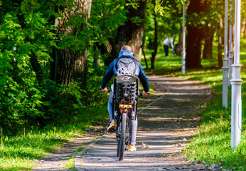 Cyclist ride on the bike path in the city Park

