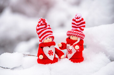 Obraz na płótnie Canvas Christmas toys stand on the snow 