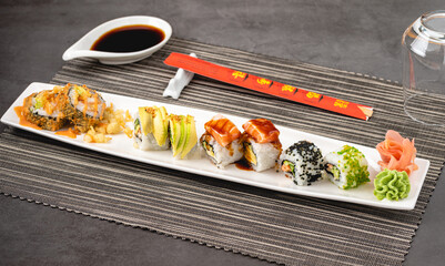 Japanese sushi set. Sushi Roll with maki and tuna, salmon, shrimp, crab and avocado.
