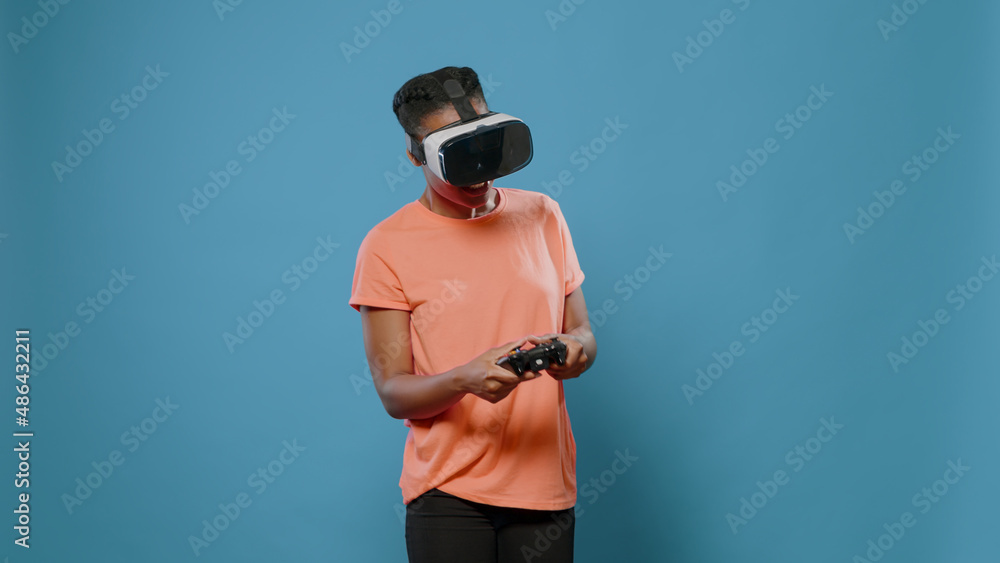 Poster portrait of casual person using vr glasses and controller to play video games and have fun with tech