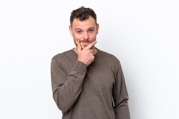 Young Brazilian man isolated on white background thinking