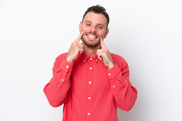 Young Brazilian man isolated on white background smiling with a happy and pleasant expression