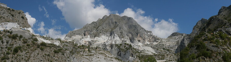 panorama of the Fantiscritti marble quarry with the mountain eroded by the extraction of the rock in the background