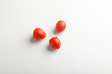 Fresh red tomato on white background.