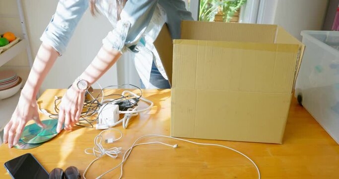 woman is recycling at home