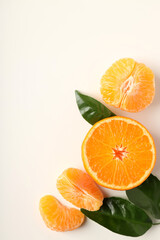 Mandarin with leaves on white background, space for text