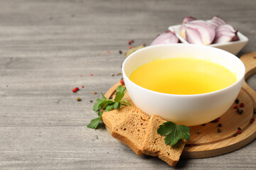 Concept of tasty food with broth on gray wooden background