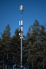 Cellular network site. Base station mast with 4G, 5G, GSM antennas