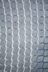 Honeycomb pattern closeup. Ice hockey net.
