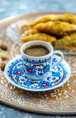 Turkish baklava and coffee on the table. Selective focus.