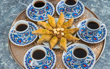Turkish baklava and coffee on the table. Selective focus.