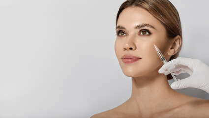 Beautiful woman receives anti wrinkle beauty injection for facial rejuvenation and wrinkle removal....