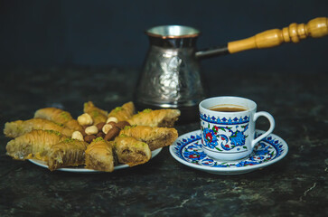 Turkish baklava and coffee on the table. Selective focus.