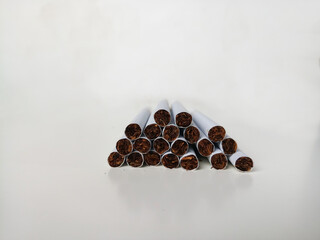 Many cigarettes stacked together. Drugs are harmful to the respiratory system.
