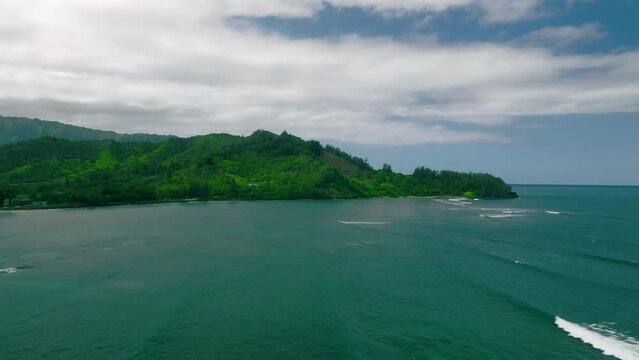 Low to High Altitude Drone Dolly Pushing Forward over Hanalei Bay, Hawaii. Blue and green island paradise.