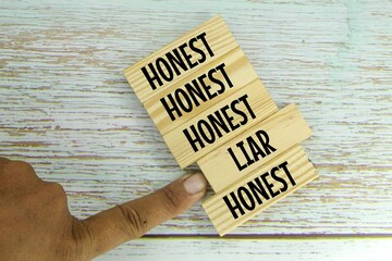 wooden boards with honest and liar words. chosen honestly