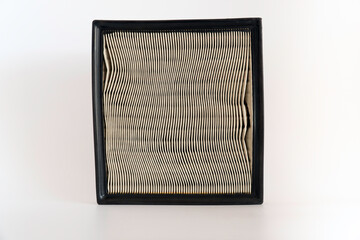 The used Paper air filter of car engine isolated on white background with clipping path