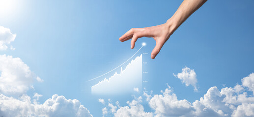 Business man holding tablet and showing holographic graphs and stock market statistics gain profits. Concept of growth planning and business strategy. Display of good economy form digital screen.