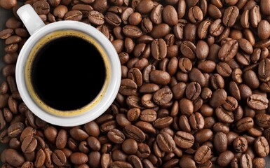 Cup of coffee with aroma roasted beans