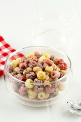 Delicious and nutritious fruit cereal loops flavorful in glass bowl