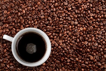 Cup of coffee with aroma roasted beans