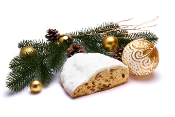 Sliced Traditional Christmas stollen cake with marzipan and dried fruit with New Year decorations