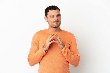 Brazilian man over isolated white background scheming something