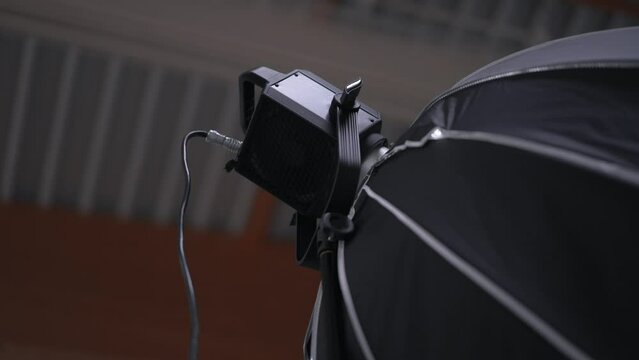 Modern Softbox LED light with power cord in photo studio, close up