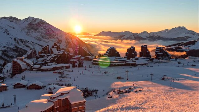 Fast motion day to night timelapse of skiers at Avoriaz Ski Resort. Beautiful sunset.