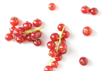 Berries of ripe tasty red currant isolated on white background. red currant with a leaf. a slide of red currants. Red currant berries with leaf isolated on white background.