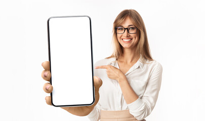 Woman showing white empty smartphone screen, closeup