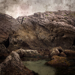 stylish textured old paper square background with landscape of coastal part of Cantabria called Costa Quebrada, the Broken coast
