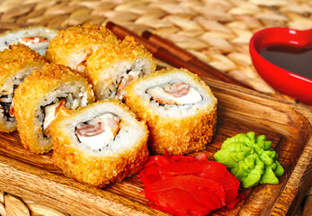 Fried tempura sushi rolls set close up selective focus. Japanese traditional fusion food style,...