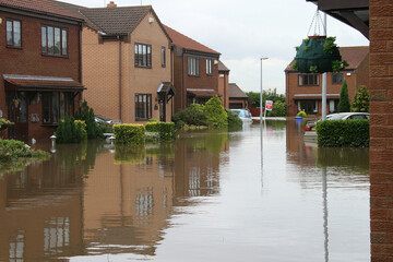 flood disaster zone, flooded houses and streets, flash flooding extreme weather 