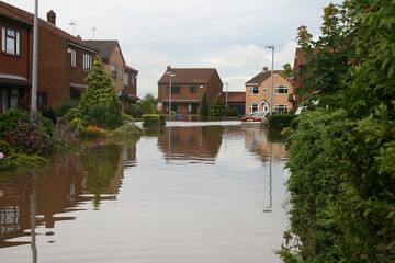 flood disaster zone, flooded houses and streets, flash flooding extreme weather 